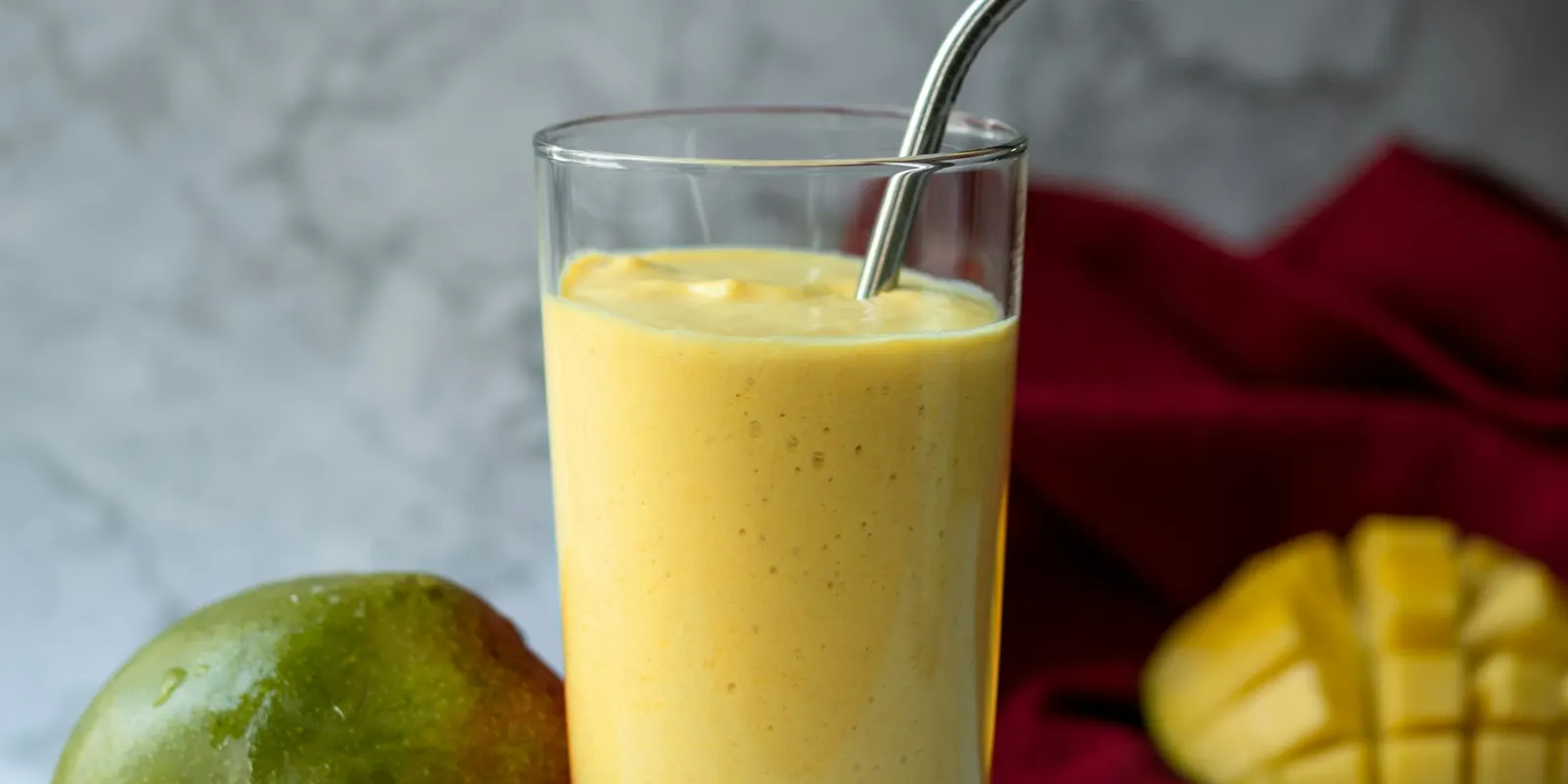 Glasses of mango lassi on a table
